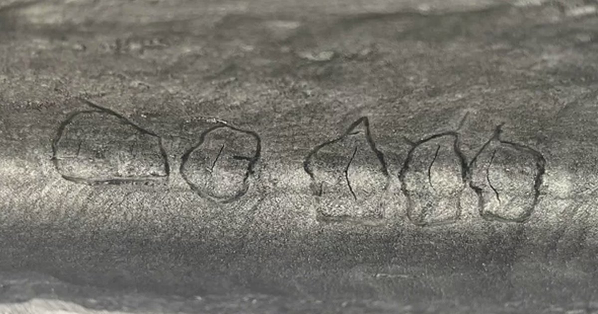 Weld cap with crack indications outlined by the inspector